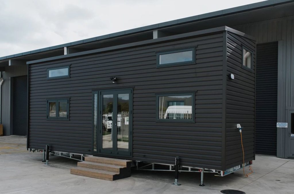 This Tiny House Has Two Staircases with Storage Integrated