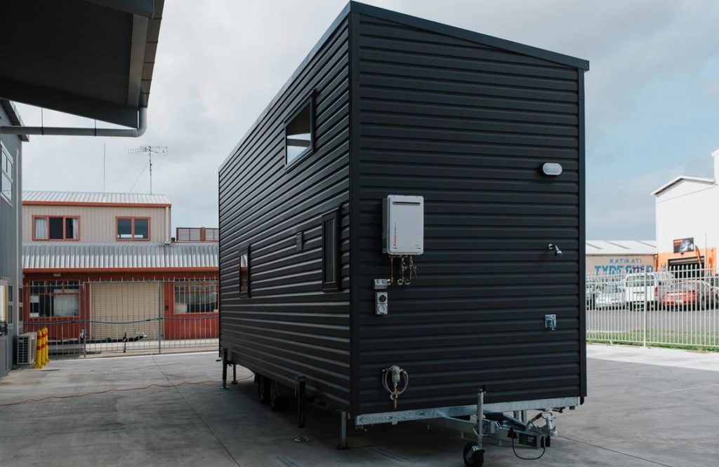 This Tiny House Has Two Staircases with Storage Integrated