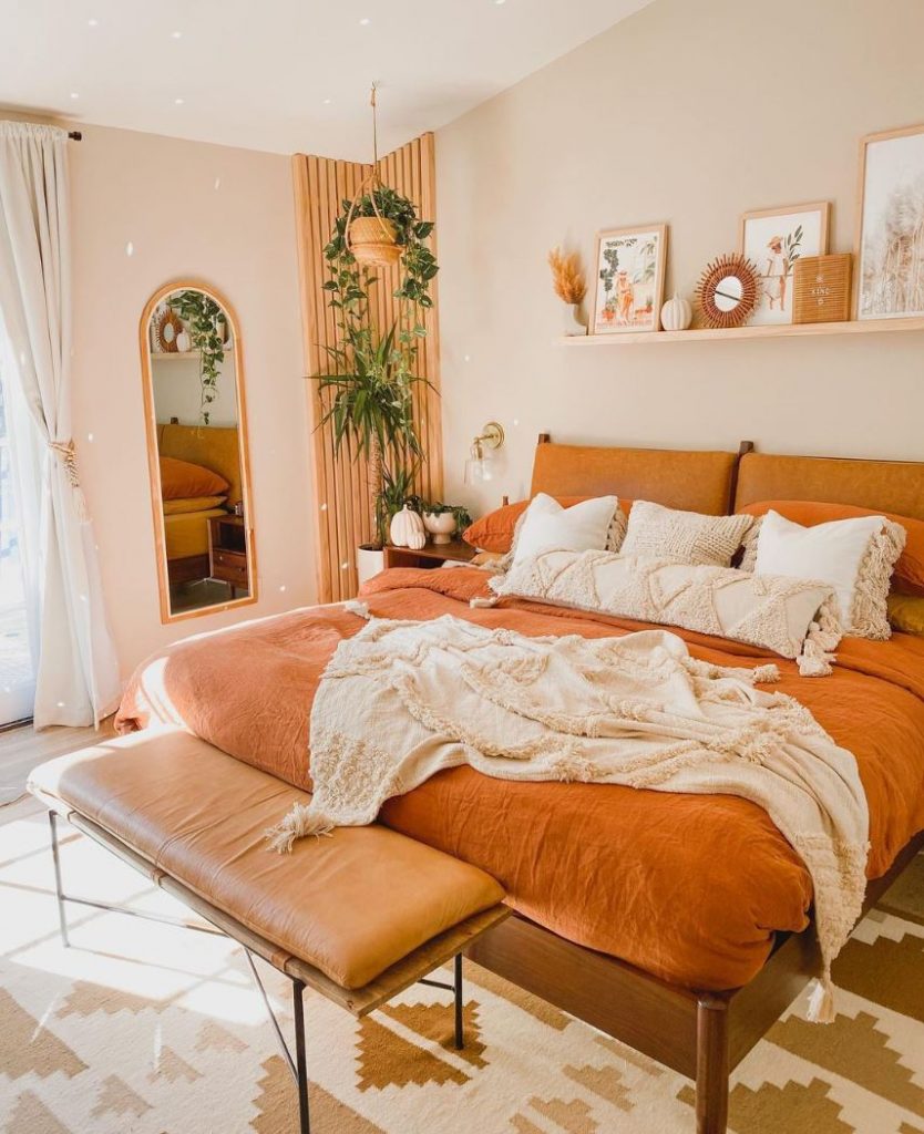Earthy boho decor with brown bed
