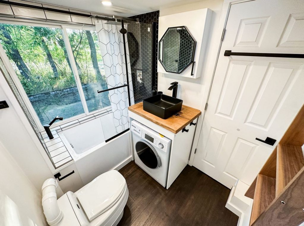 Black sink in a small bathroom