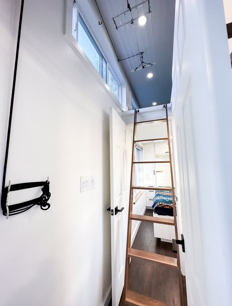 Hanging laundry rack in a tiny house