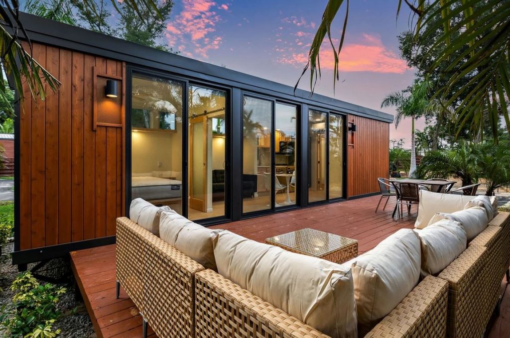 Modern tiny house with an outdoor lounge area